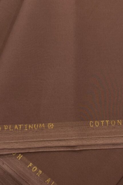 Elegant brown cotton fabric with gold text detail.